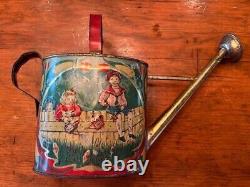 Antique vintage early 1900s Victorian toy metal watering can children graphics